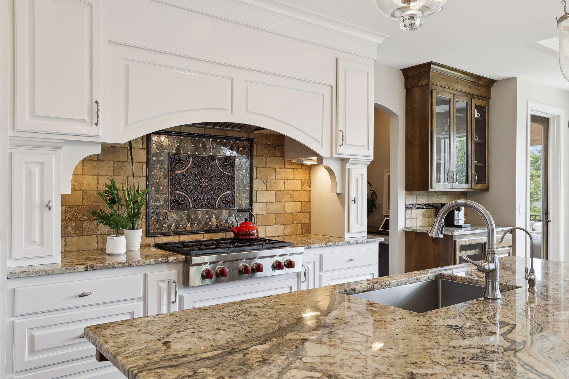 Cooktop wall with custom tile backsplash.