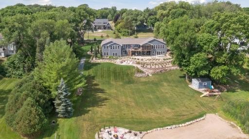 Perfectly perched on a private 1.11 acre lot overlooking lovely Piersons Lake