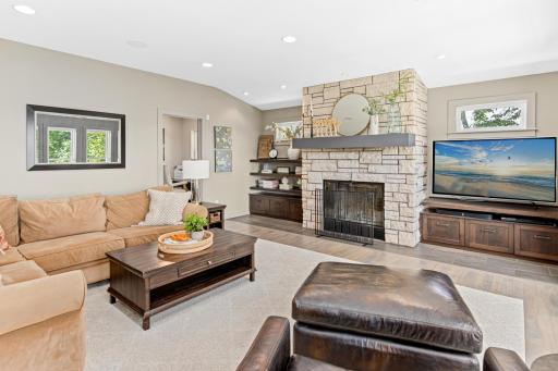 Cozy up next to the wood-burning, stone fireplace in colder months
