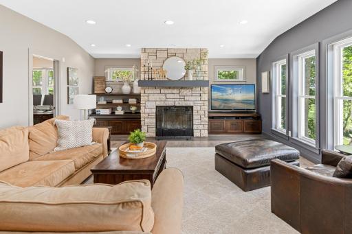 The main level living room is filled with an abundance of natural light