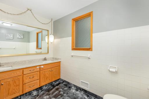 Main floor bathroom has modern touches yet holds on to the MCM feel.