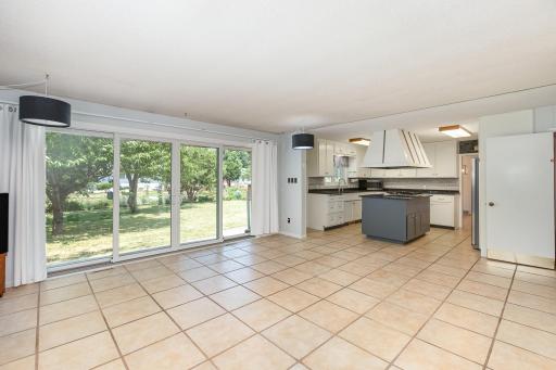 Informal dining area and living space. You'll love the span of sliding glass doors looking out onto your back yard.