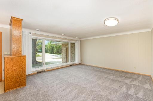 Gigantic front window facing south brings in loads of natural light.