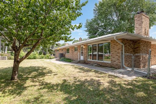 Back of home with beautiful exposure of back yard.