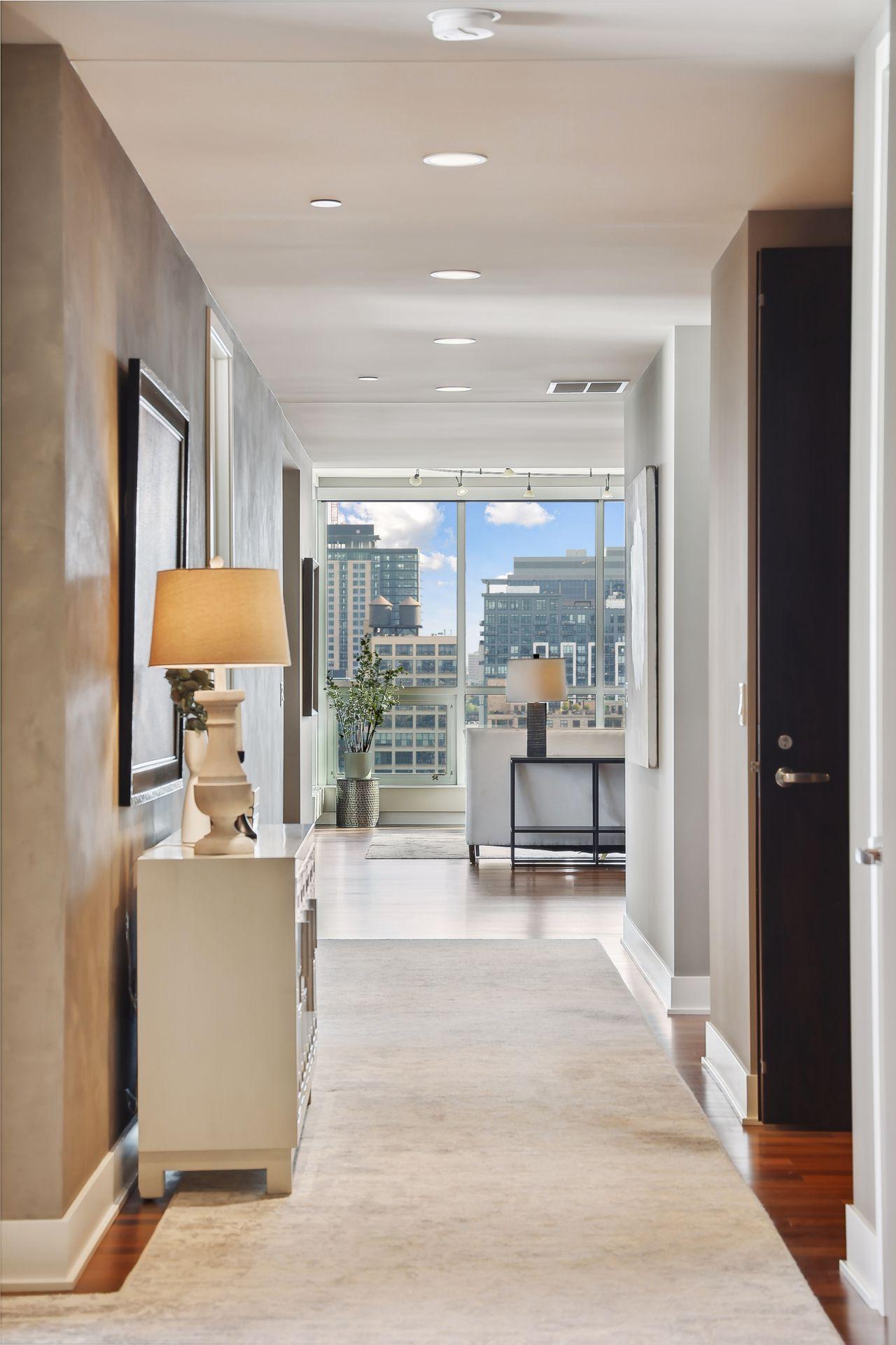 The first view of your home that your guests will see...walking toward the main living area from the foyer/elevator through the art gallery corridor.