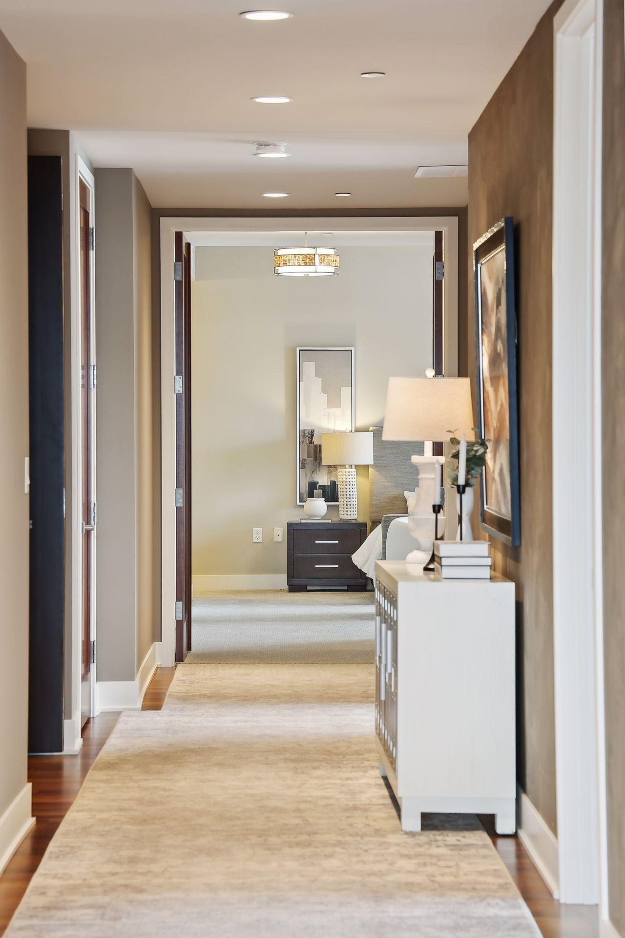 The main corridor features a custom designed and cut wool rug.