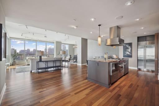 Gleaming hardwood floors run throughout this condo, well appointed and well placed appliances in the kitchen to please the most finicky chef. Positionable lighting above the cooking/preparation area .
