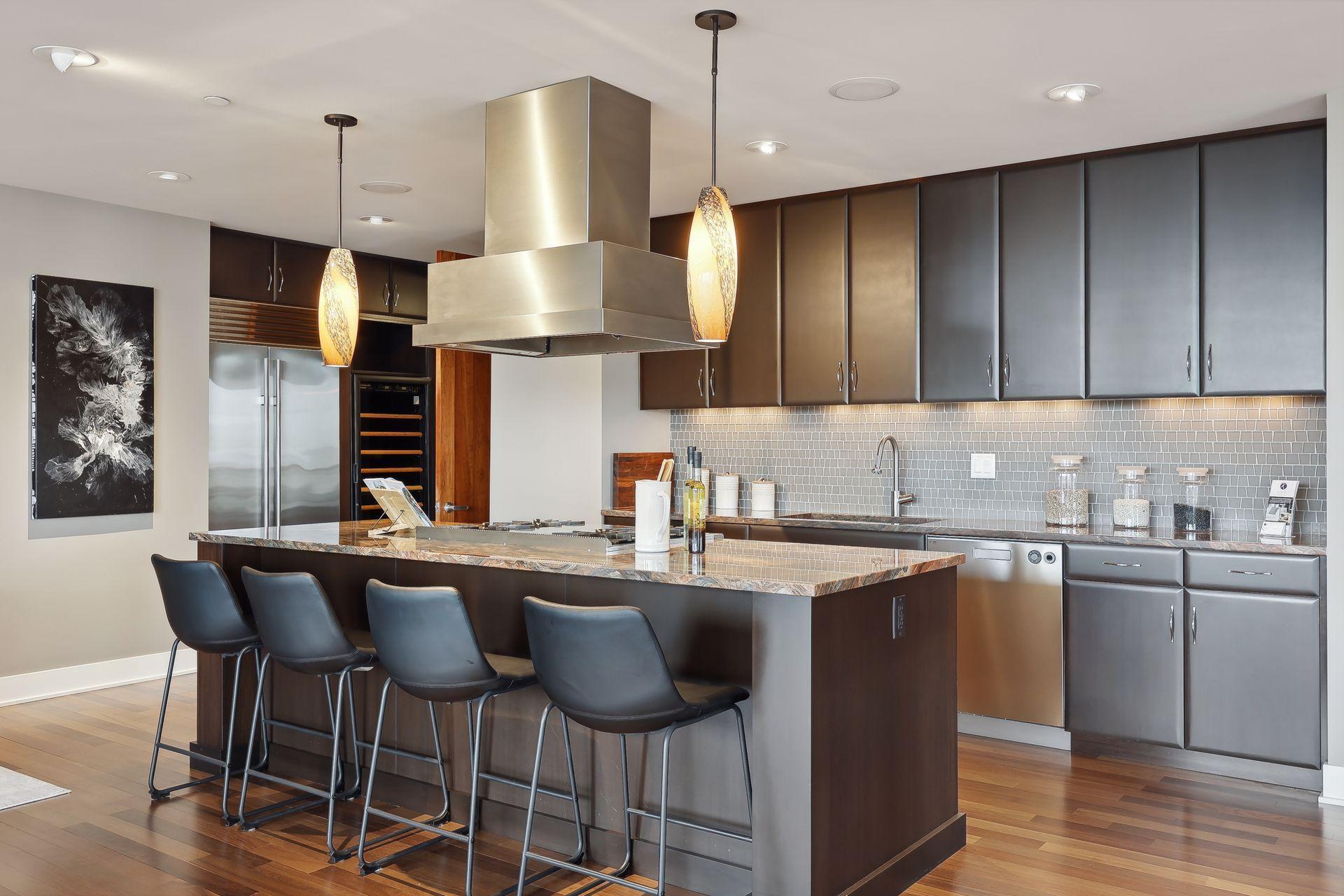 Premium appliances include Sub-zero refrigerator/freezer, EuroCave Duo wine cooler holding 88 bottles plus champagne storage. Added plus of direct venting in main kitchen and butlers pantry.