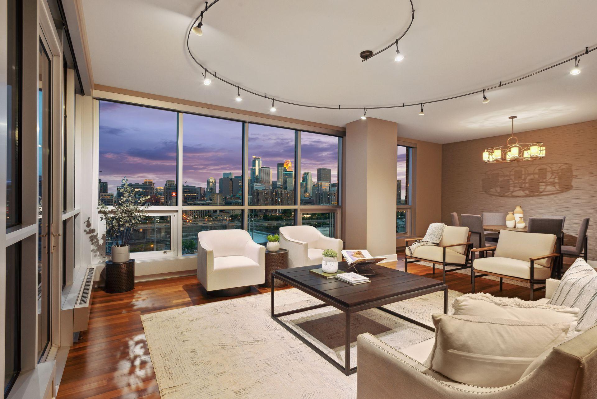 This dramatic lighting encircling your main entertaining area can be adjusted to highlight focal points. The skyline view comes through from the floor to ceiling windows with 3M protection film.