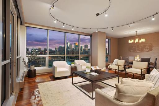 This dramatic lighting encircling your main entertaining area can be adjusted to highlight focal points. The skyline view comes through from the floor to ceiling windows with 3M protection film.