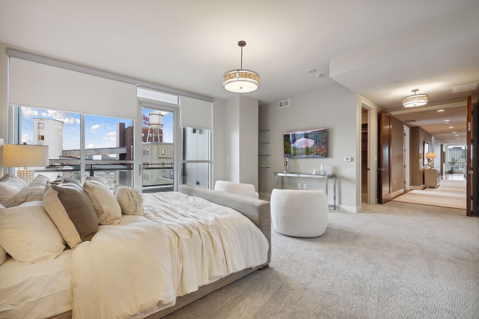 Enjoy the view of Flour tower with the dramatic lights at night from bed! 2nd closet can be seen just past the entry to the suite.