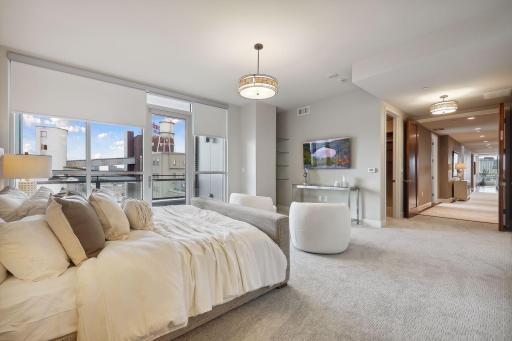 Enjoy the view of Flour tower with the dramatic lights at night from bed! 2nd closet can be seen just past the entry to the suite.