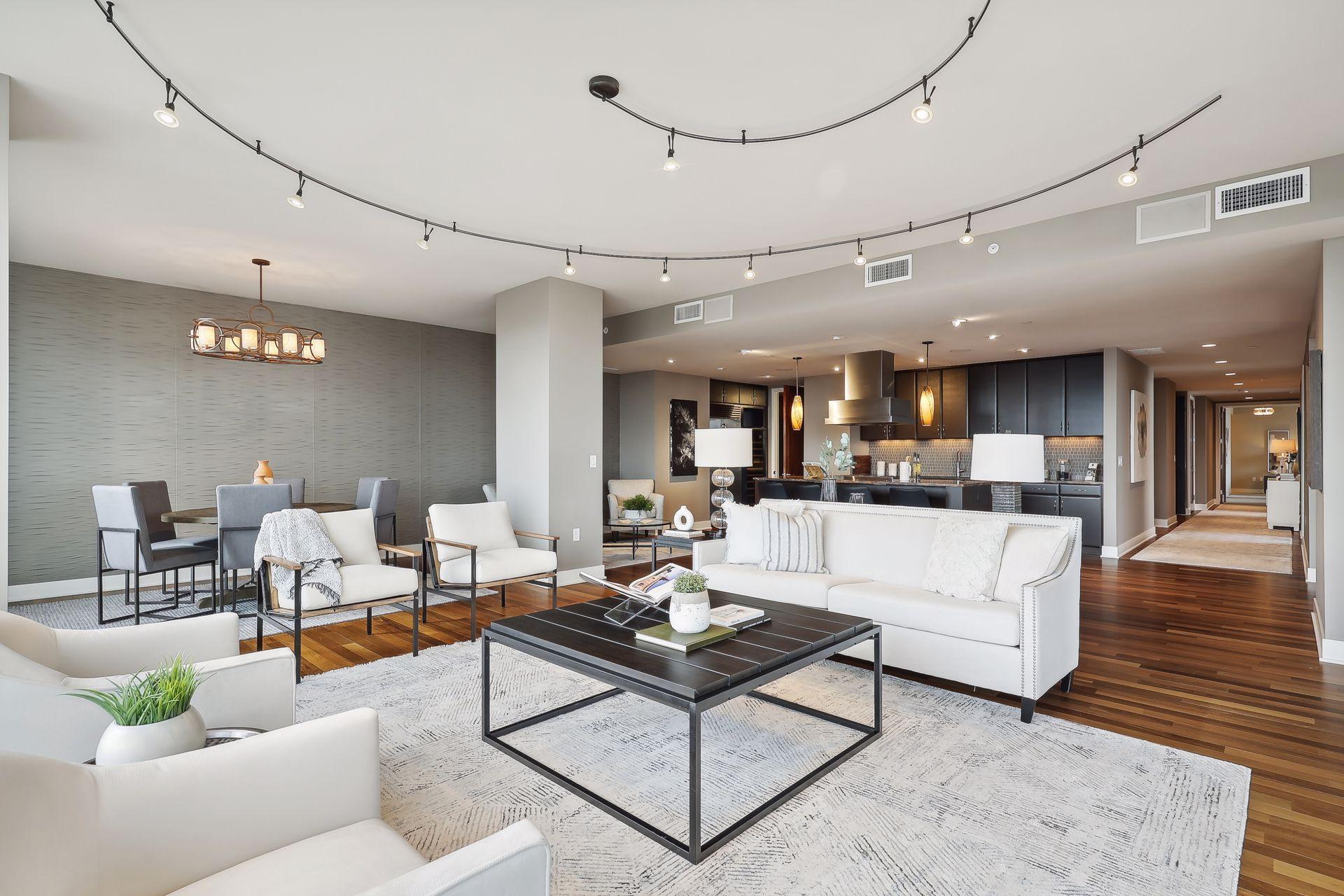 View the primary suite from the main living area at the end of the gallery corridor.