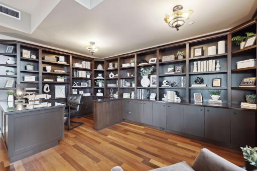 At home in your home office or library with ample display shelves and cabinetry.
The handblown light fixtures add a touch of whimsy.