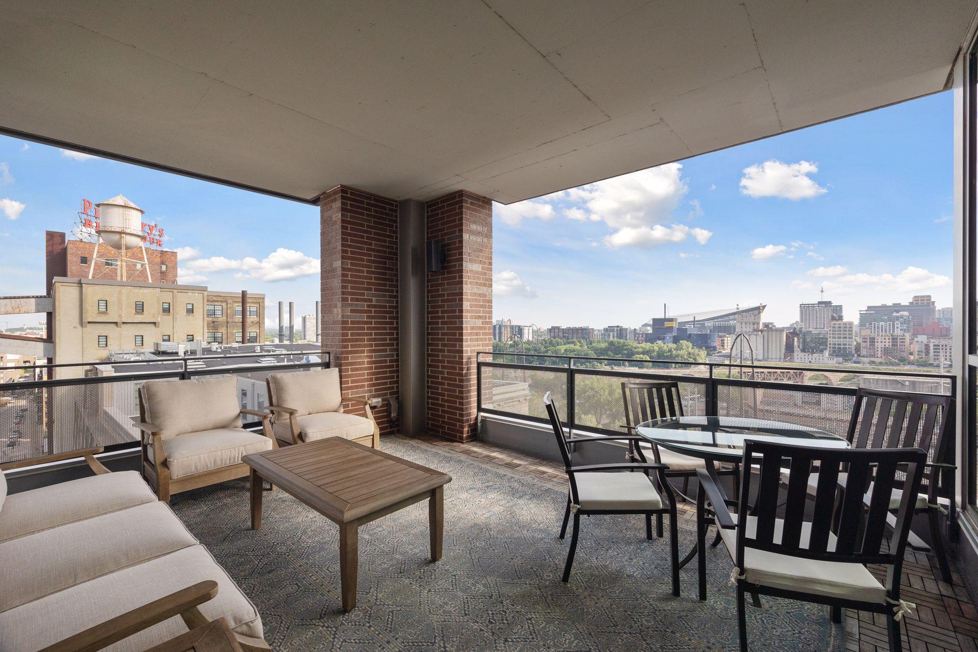 Pillsbury water tower to the left and US Bank stadium across the river to the right add great interest to your outdoor room, all three terraces have Acacia wood flooring. This area has a gas line for grilling.