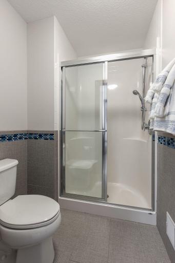 Seperate room for toilet and glass shower doors