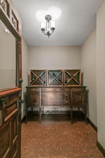 Old world antique door with cork flooring wine cellar
