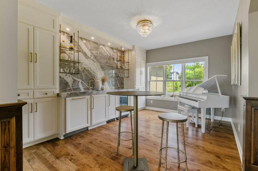 Appliances include cabinet paneled Asko dishwasher, Scotsman ice maker, beverage refrigerator