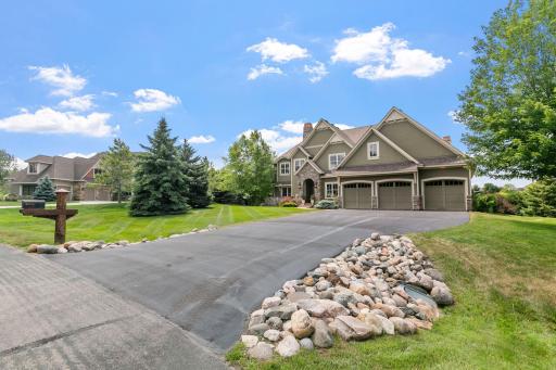 Enjoy the meticulously manicured lawn, boulder retaining walls, gardens, and mature trees. The property is bordered by the natural beauty of the Credit River landscape and offers access to scenic walking trails.