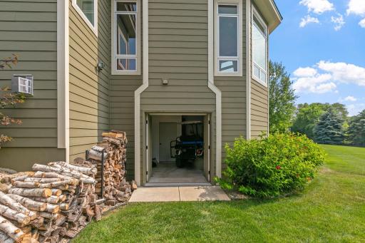 French doors open up to the storage room for lawn equipment or golf cart!