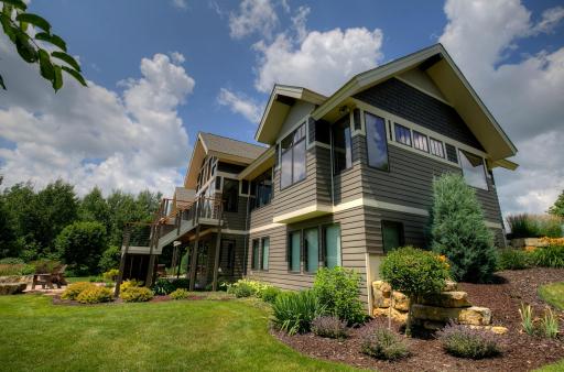 Rear yard has amazing views, lovely decks, hot tub, and firepit. Perfect for entertaining!