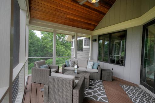 The screen porch features a wood covered vaulted ceiling.