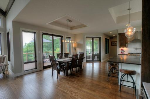 Dining area has a glass door to the deck area. French doors lead to the screened porch.