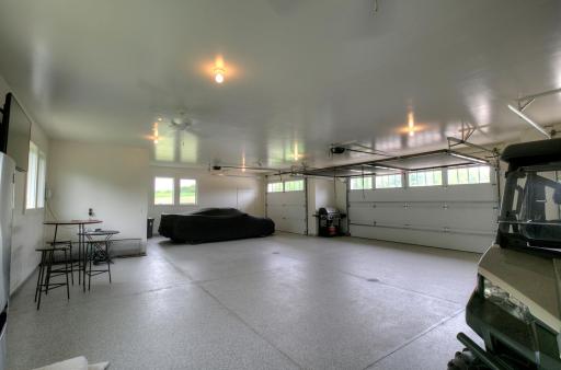 The four-car garage fits 5 cars and other quipment.