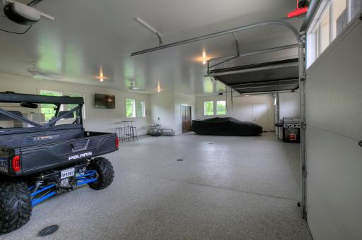 Center double garage door has a full roll-down screen so you can enjoy the garage as an additional screen room.