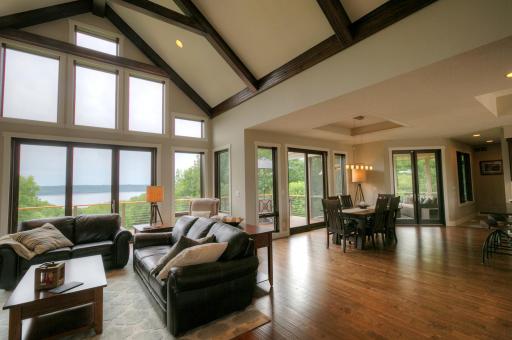 The main living area is open and bright! You will love the 18-foot beamed vaulted ceiling. Flooring is hewn walnut.