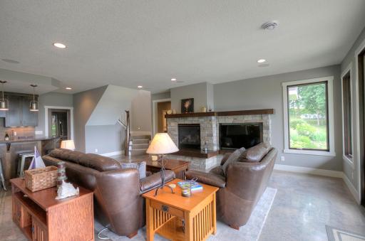 A stone gas fireplace and a wet-bar make the family room a great place to entertain.