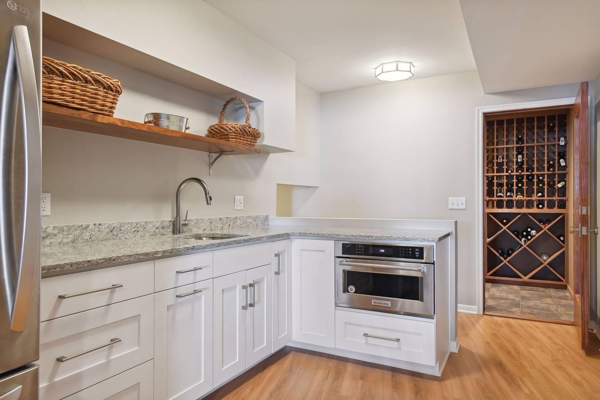 Lower level second kitchen/bar area with wine cellar.