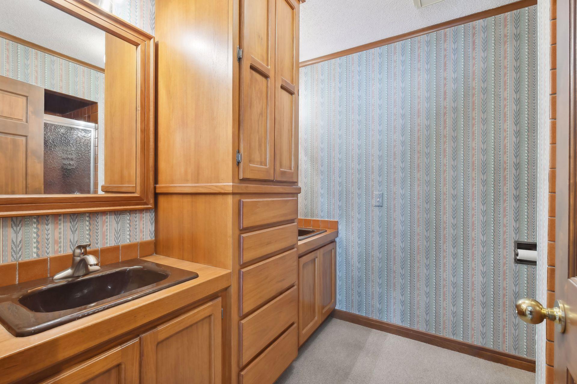 Ensuite 3/4 bathroom off of den.