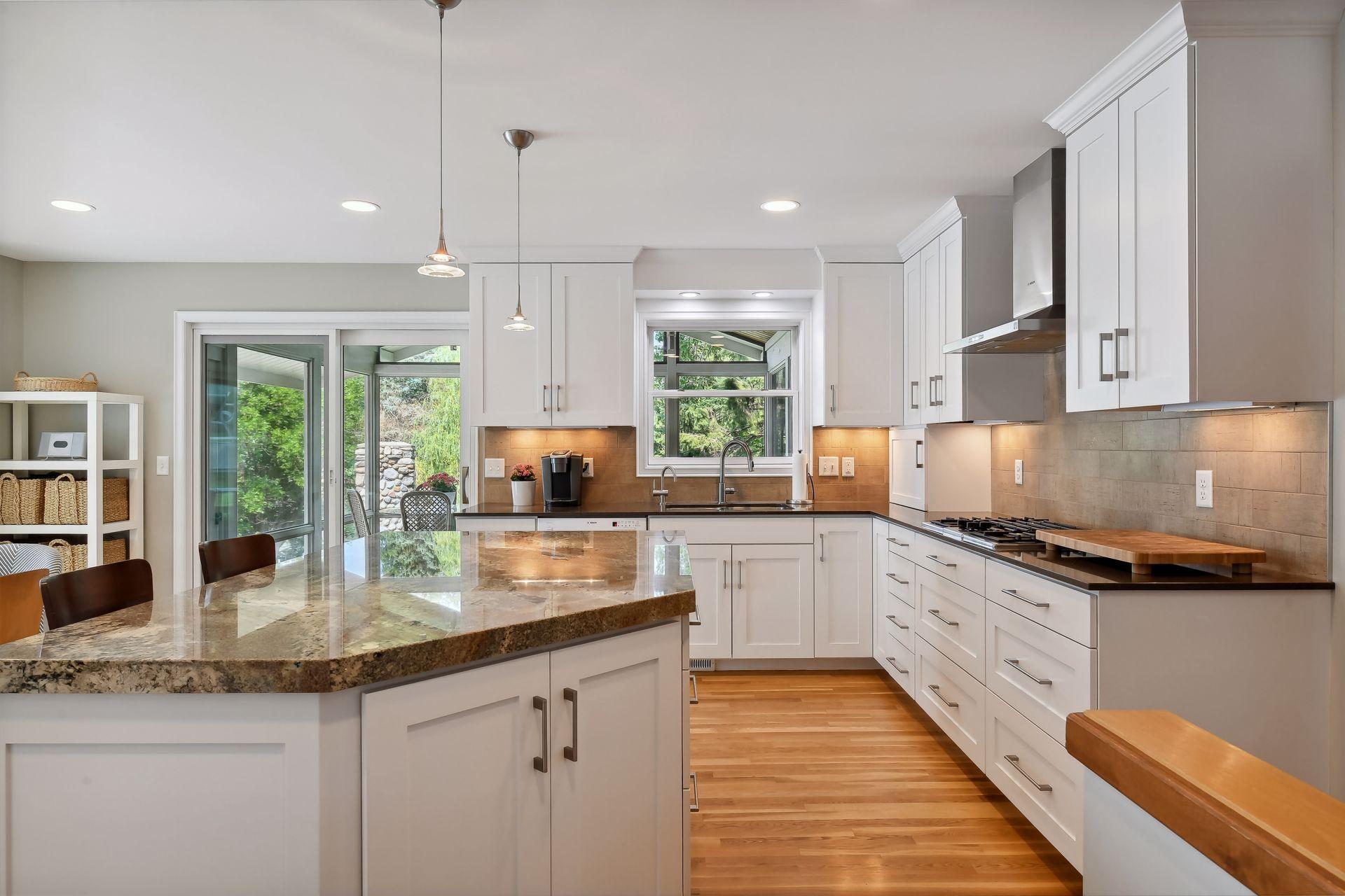 Remodeled kitchen with large center island.
