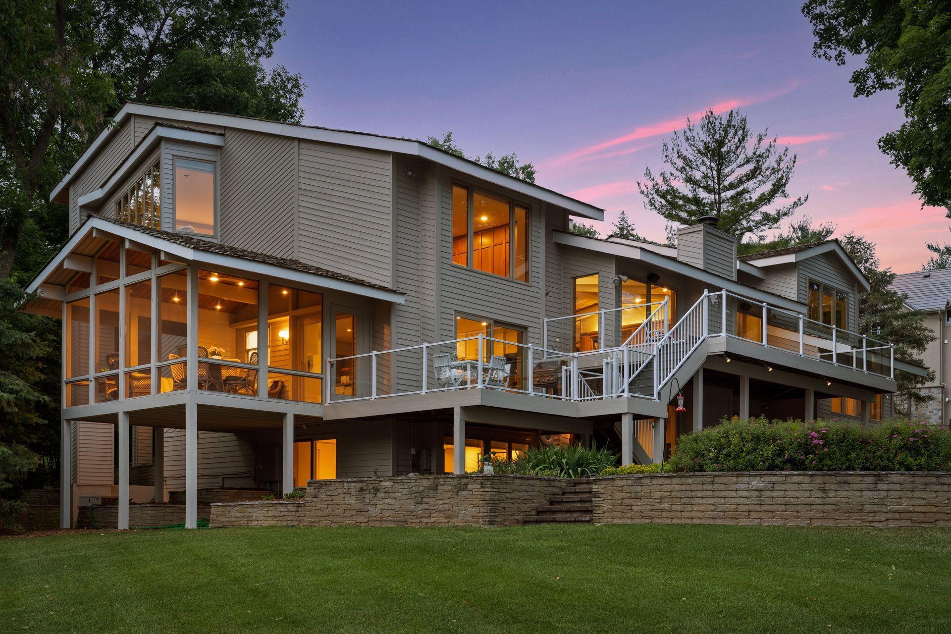 Multiple levels of deck facing Lake Minnetonka views.