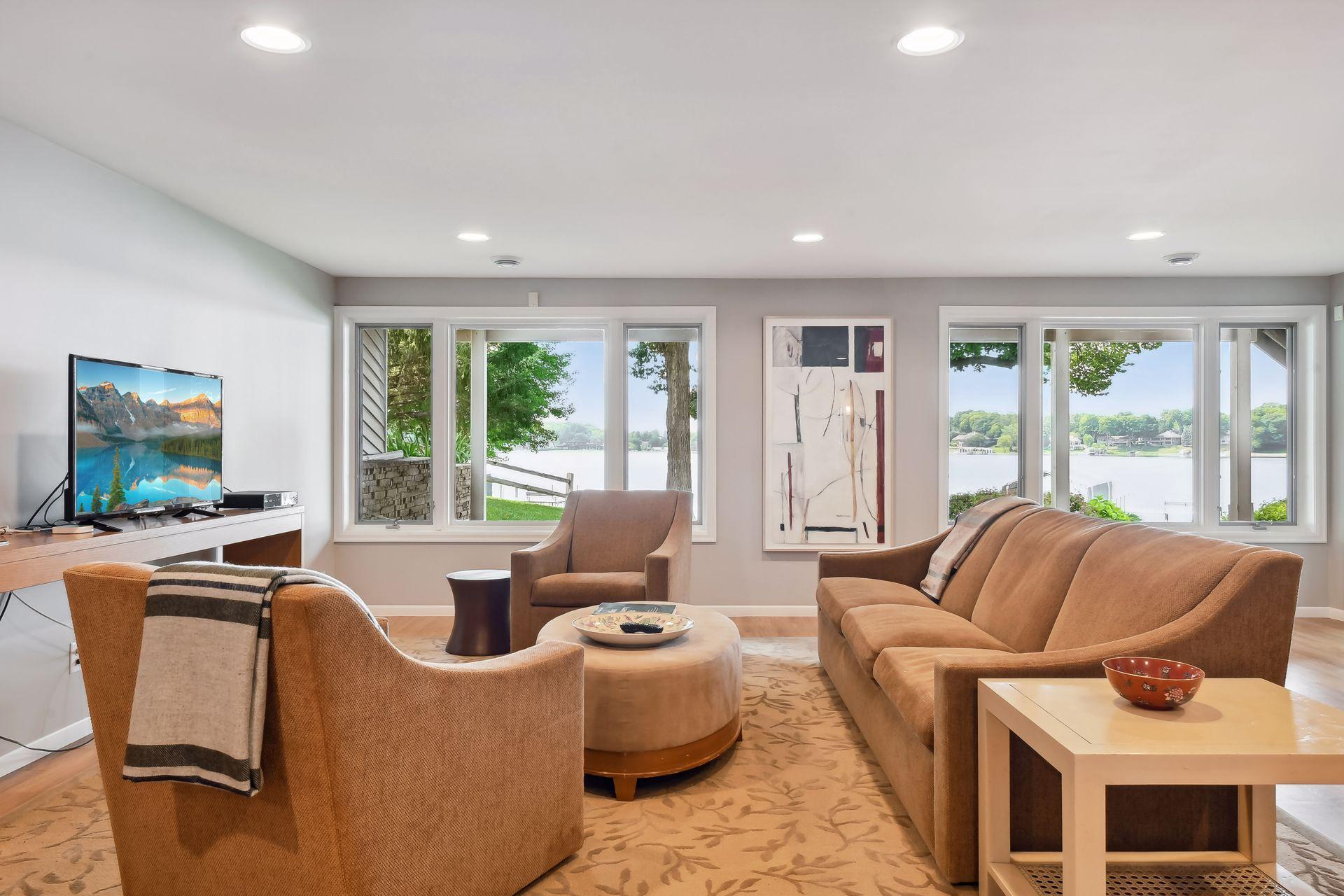 Walk-out lower level amusement room with views of the lake