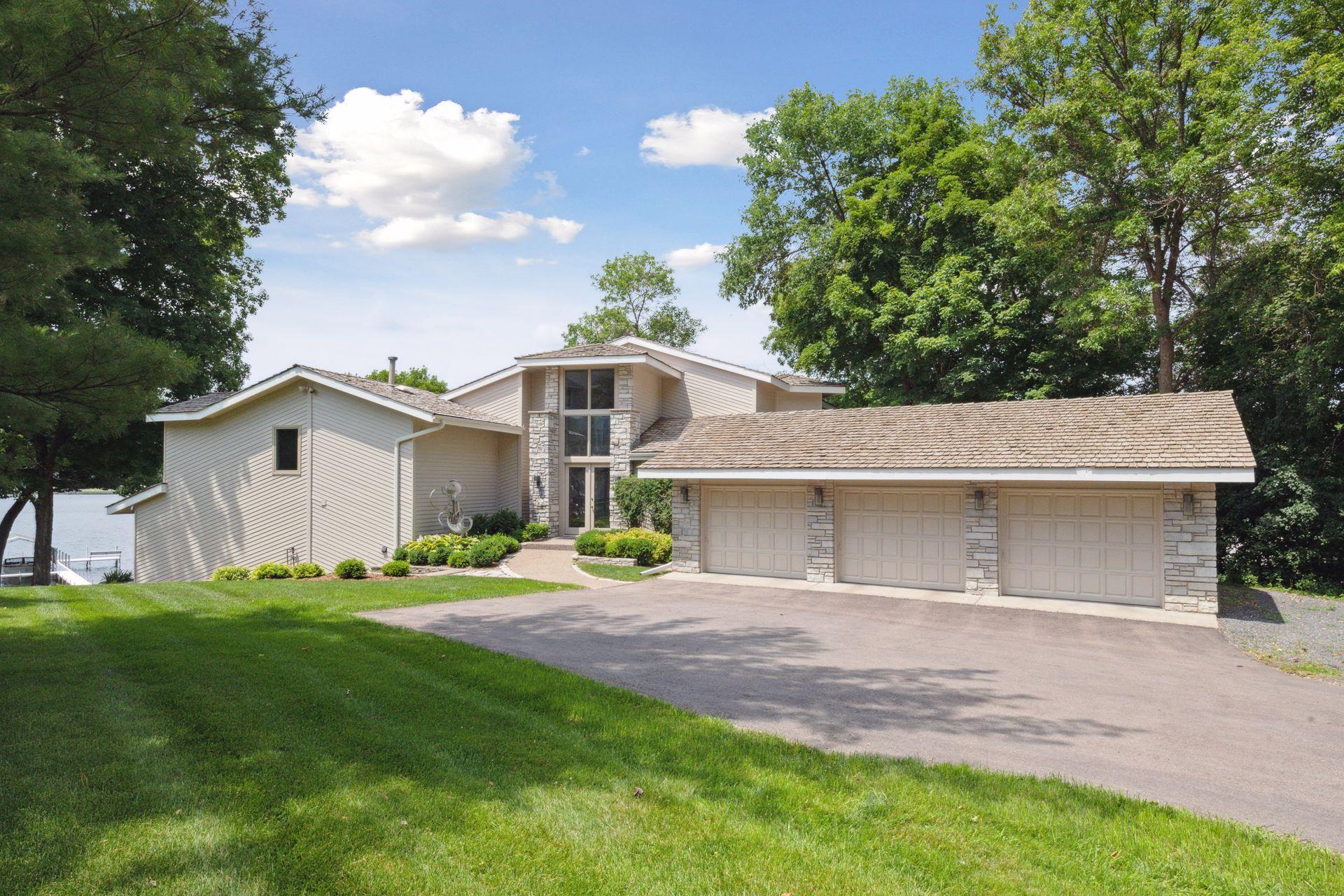 Large driveway and three car garage.
