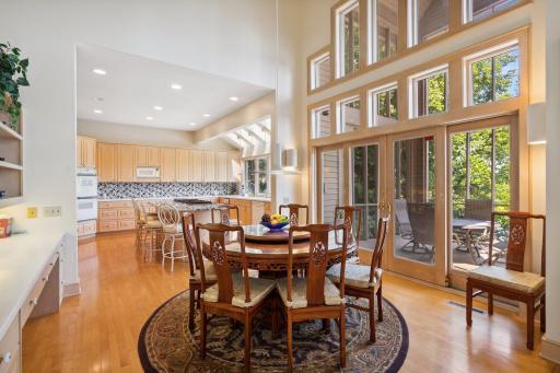 Informal dining room with floor to ceiling windows