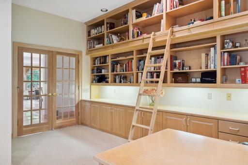Large main floor office with library shelves