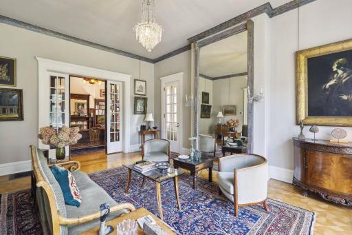 Photo for 495 Summit Avenue, Saint Paul, MN 55102 - Listing #6400517 Suspended from the ceiling, a resplendent chandelier casts a warm glow, adding to the room's ambiance
