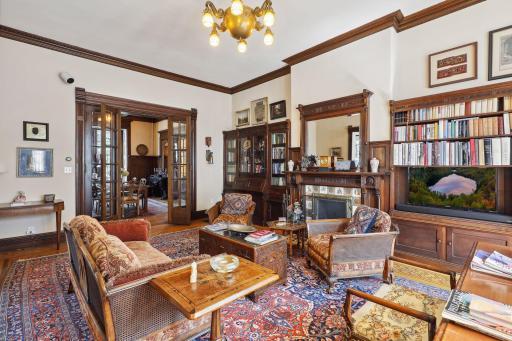 Photo for 495 Summit Avenue, Saint Paul, MN 55102 - Listing #6400517 The built-in bookshelves provide ample space for your collection, while a cozy fireplace, adorned with intricate carvings, provides warmth and a touch of nostalgia