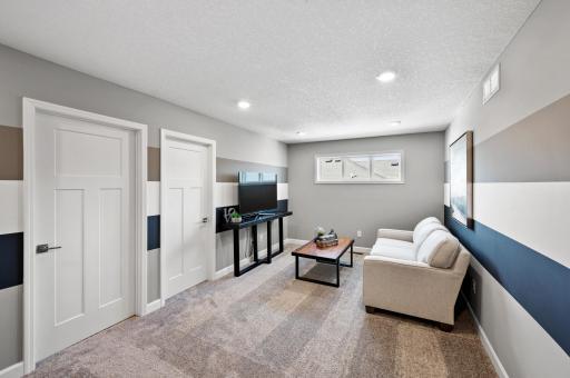 Located on the upper level, just steps away from all four bedrooms, this perfectly sized living space has enough room for a desk, television, and seating for the entire family. Photo of identical Lewis floorplan. Actual home finishes may vary.