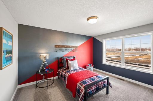 Each of the home's secondary bedrooms on the upper level come perfectly sized and all feature a spacious closet. Photo of identical Lewis floorplan. Actual home finishes may vary.