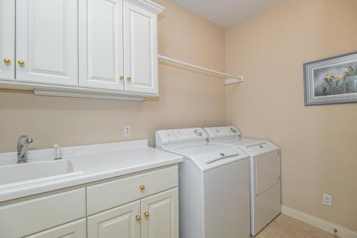 Main floor laundry w/ heated tiled floors