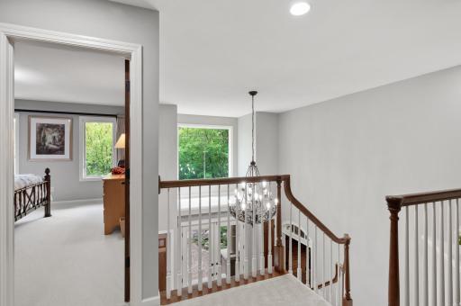 Upper-level landing area with lots of natural light is your entrance to the three large upstairs bedrooms.