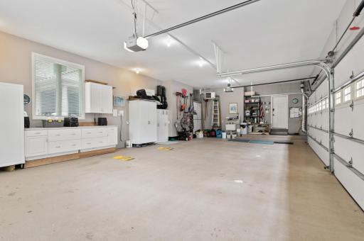 This garage features two oversized double doors and it's deep footprint provides a tremendous amount of storage space. The garage has good natural light, epoxy floor covering, 4 floor drains, utility sink, and a gas heater for the MN winters.