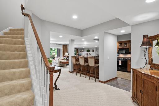 lower level walk-out welcomes you with natual light and a full kitchen and bar for entertaining.