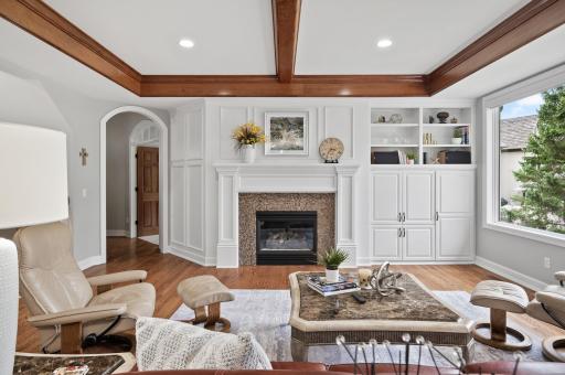 Custom built in cabinets, entertainment center, and outdoor views will make you never want to leave your family room!