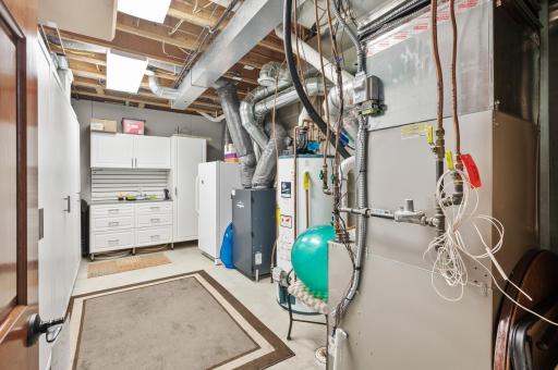 One of two lower-level storage rooms. This home has dual water heaters and dual zone heating/cooling.