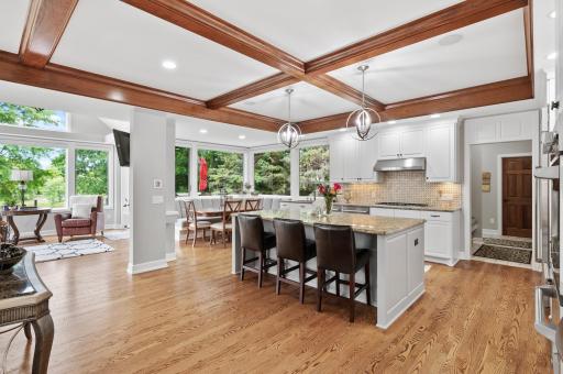Just off the kitchen is your sun room and informal eating area with custom table.